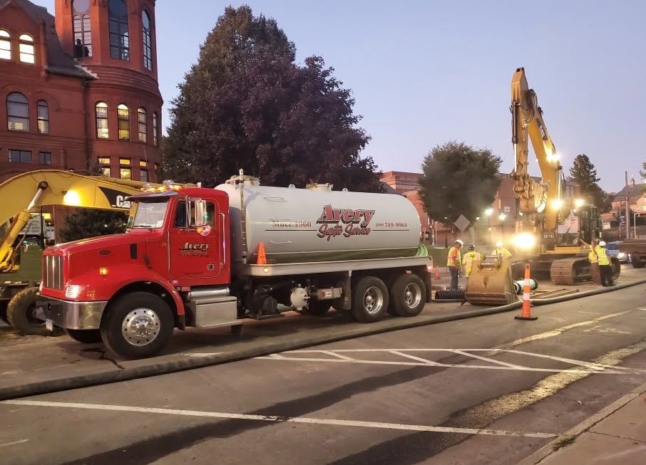 trucks working in street